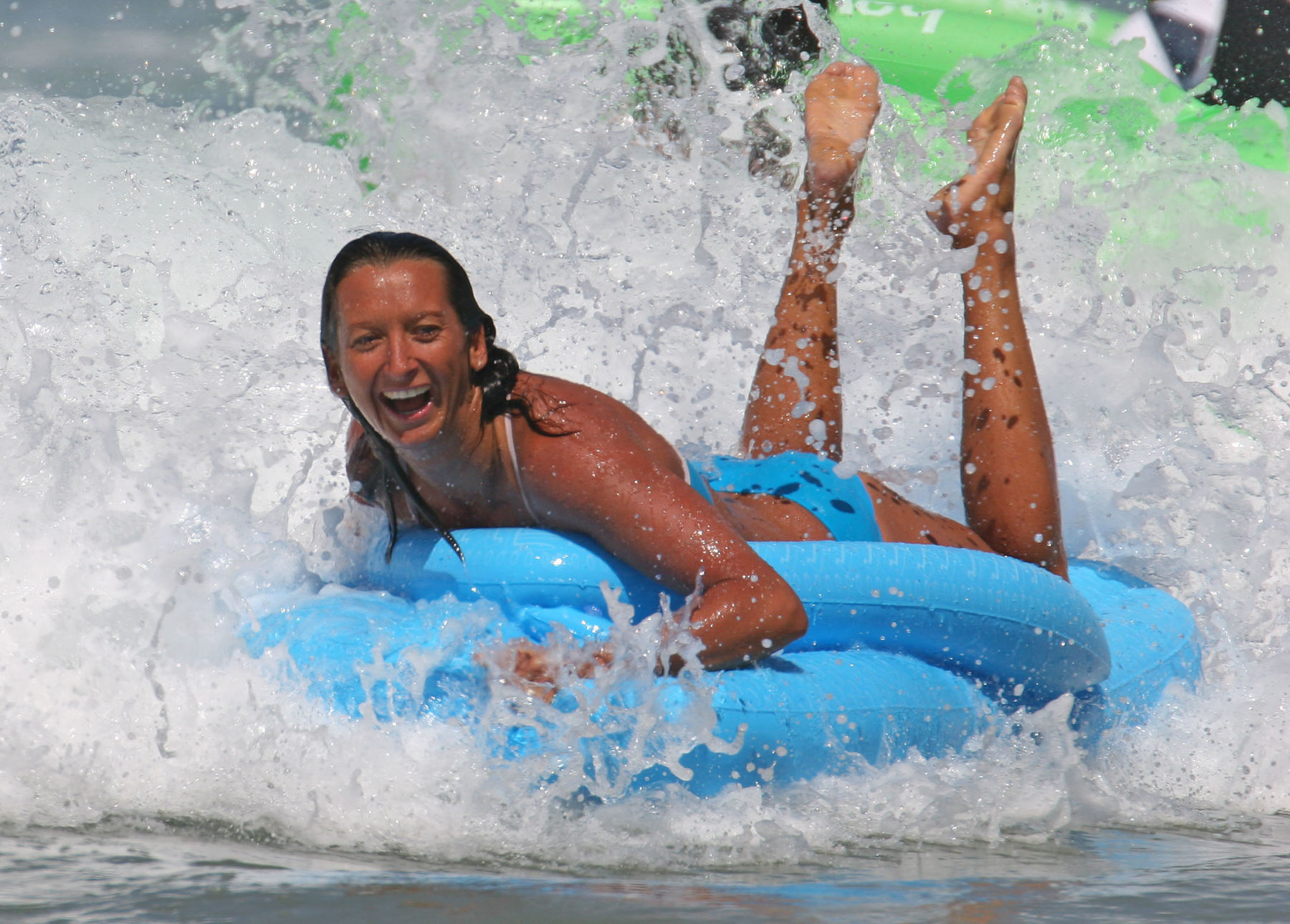 layne-beachley-tan-having-fun-on-inflatable